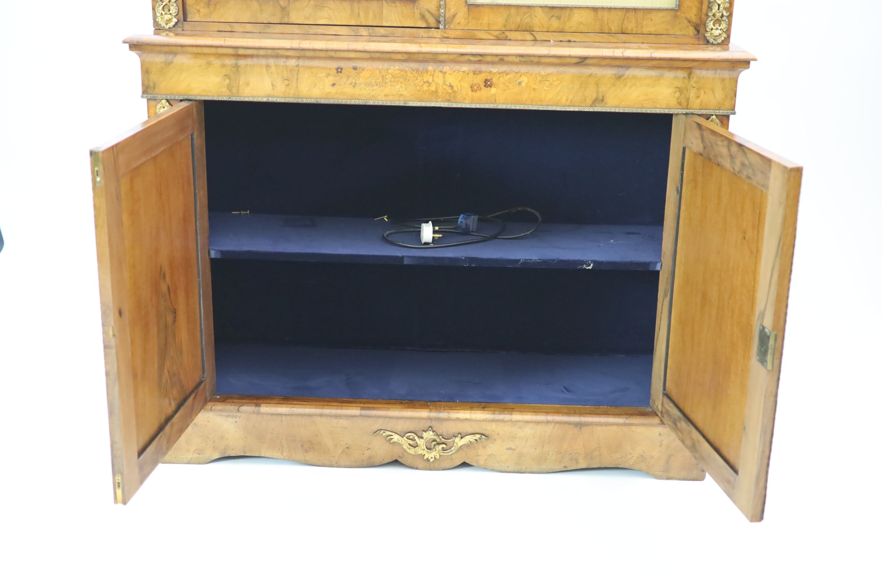 A Victorian ormolu mounted marquetry inlaid walnut bookcase, W.127cm D.40cm H.208cm
